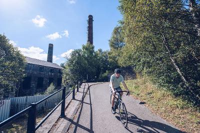 Cyclist on path at Hafod Copperworks.