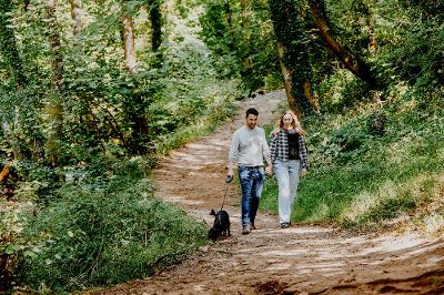 Couple and dog walking on path to Three Cliffs from Parkmill.